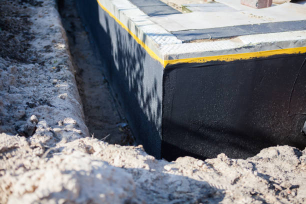 Professional Basement Waterproofing technician working in Drexel Hill, PA